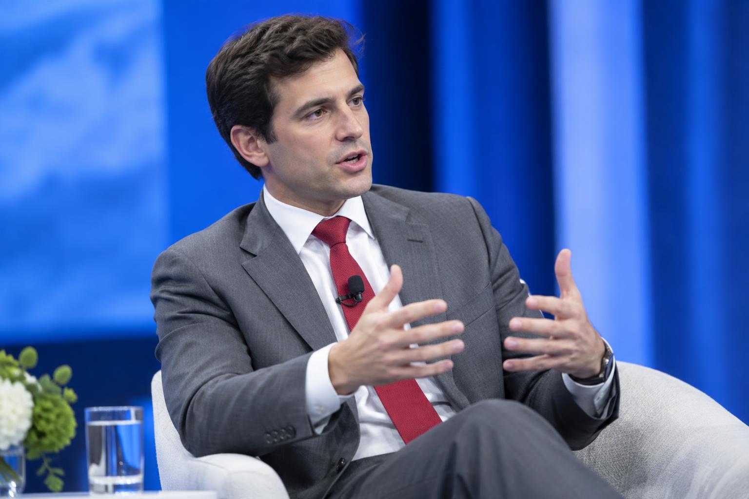 A speaker on a conference stage